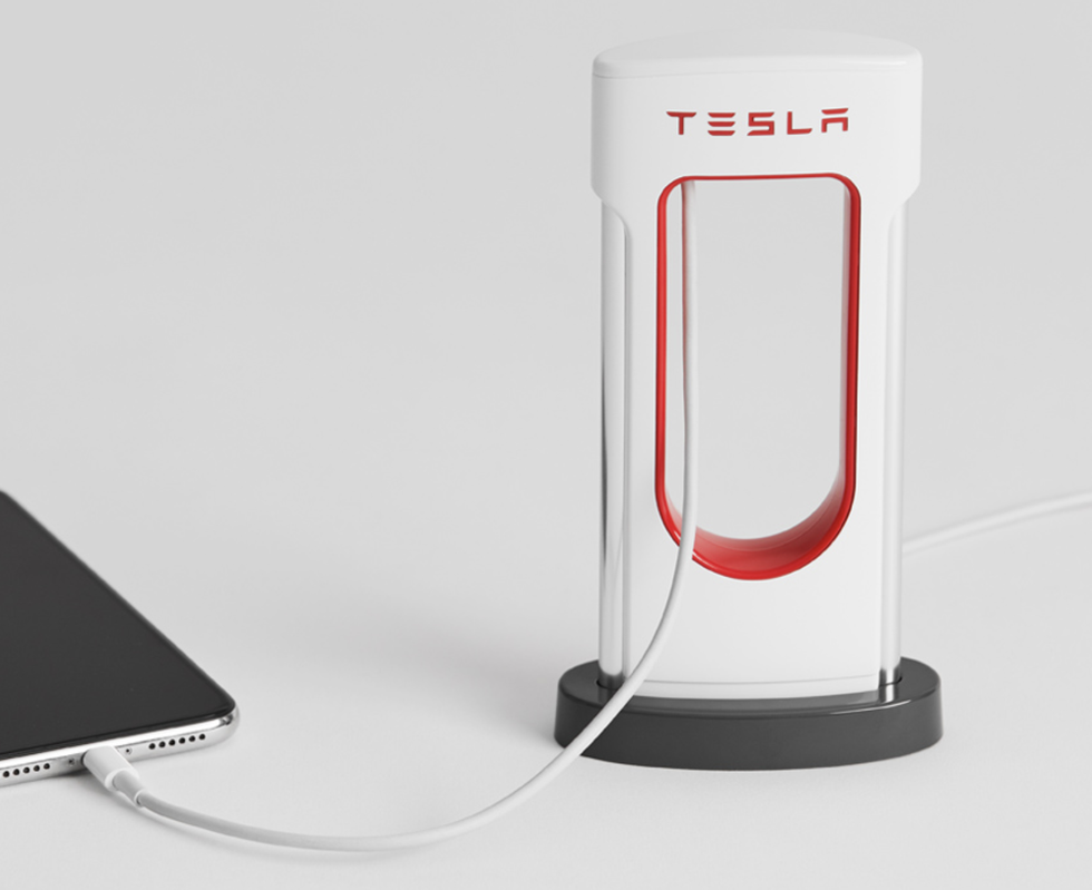 Picture of Tesla's miniature Supercharger charging a smartphone