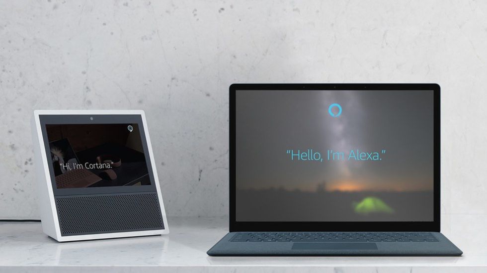 Picture of Amazon Echo Show with Alexa and Microsoft computer with Cortana which can now talk to each other.