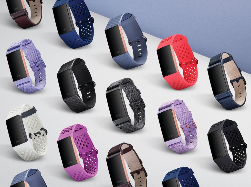 Picture of a bunch of fitbits and health trackers.