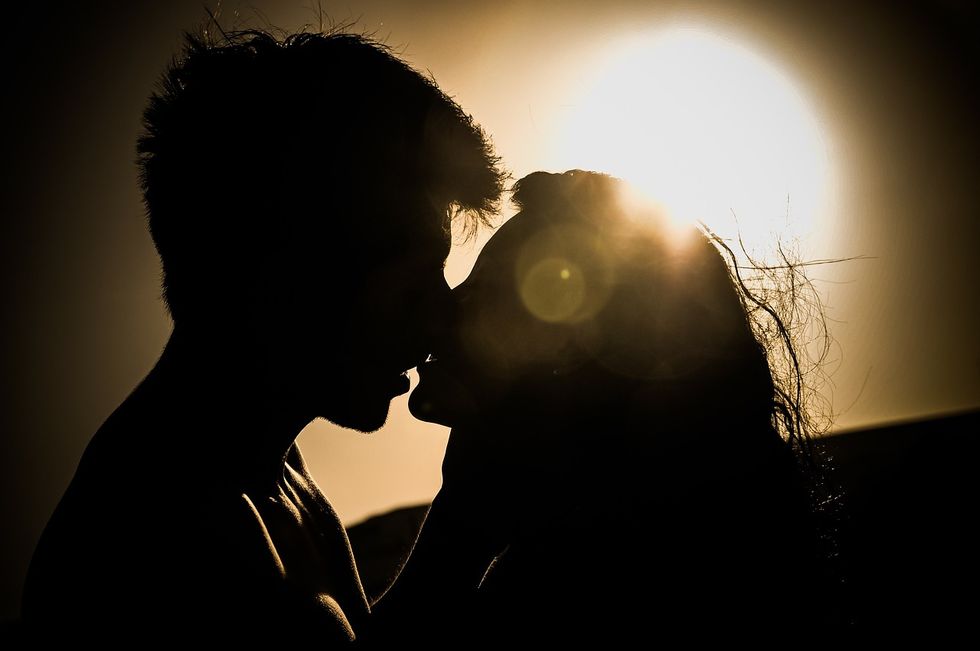 A couple going in for a kiss.