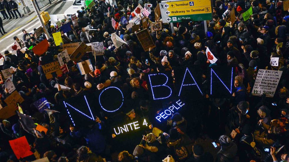 Protestors rally during a demonstration against the Muslim immigration ban at John F. Kennedy International Airport on January 28, 2017 in New York City. (Photo by Stephanie Keith/Getty Images)