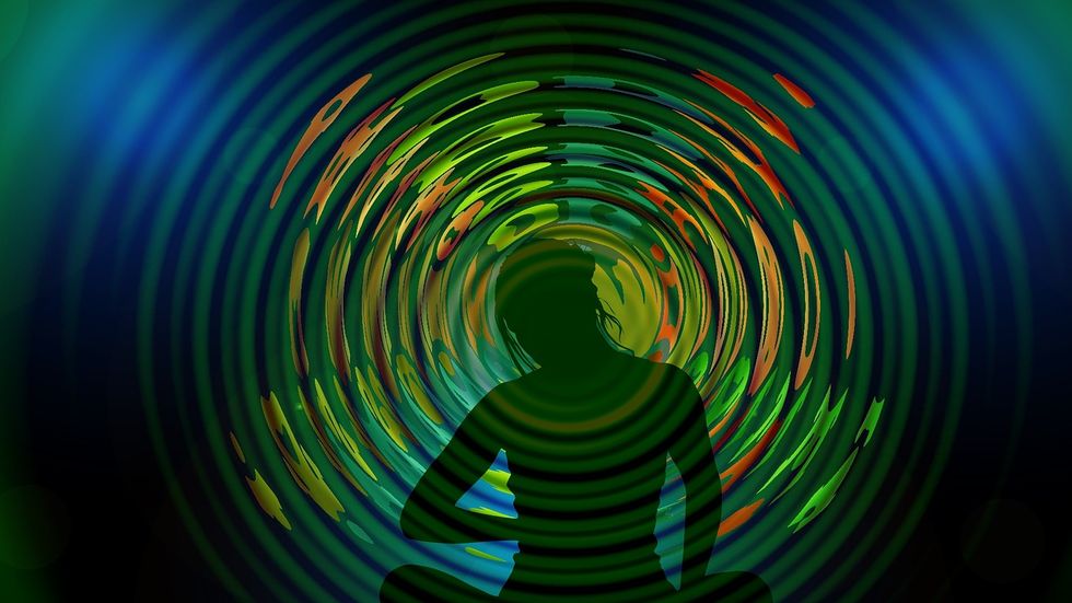Colorful waves around a person.