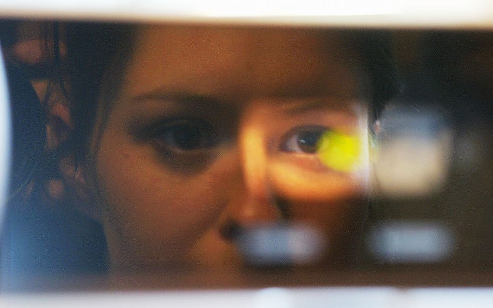 Woman undergoing a retinal scan.
