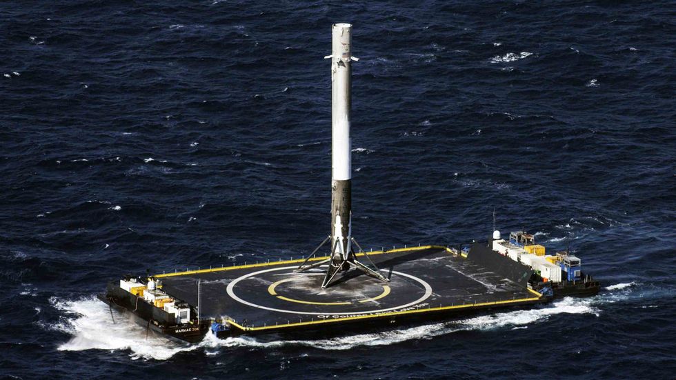 SpaceX's Falcon 9 rocket stands after making its first successful upright landing on the 'Of Course I Still Love You' droneship on April 8, 2016 some 200 miles off shore in the Atlantic Ocean after launching from Cape Canaveral, Florida. (NASA via Getty I