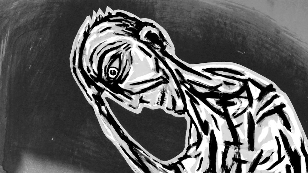 A painted mural of a depressed figure.
