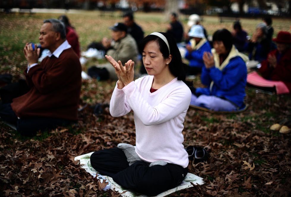A woman meditating.