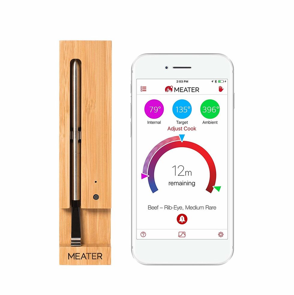 Picture of meater smart thermometer and app on smartphone.