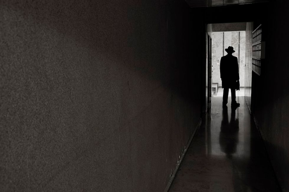 Man in dark hallway