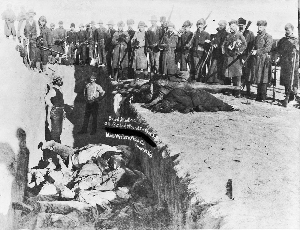 Burying the dead at Wounded Knee.
