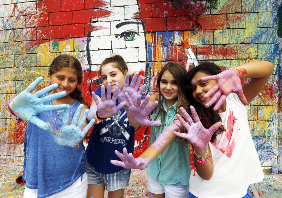 Creative Young Kids with Paint on their Hands