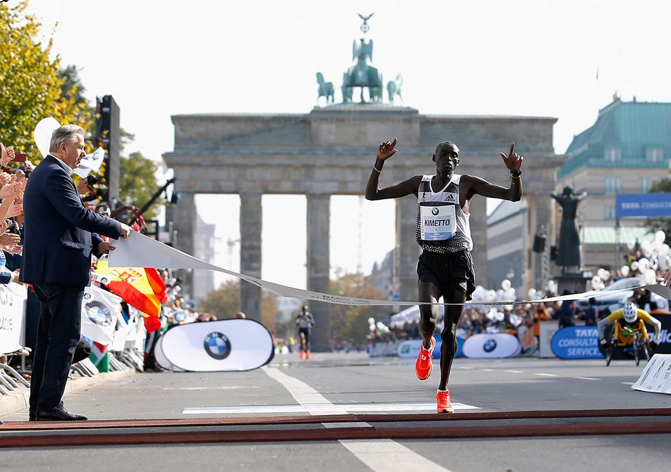Dennis Kimetto of Kenya crosses a marathon finish line.
