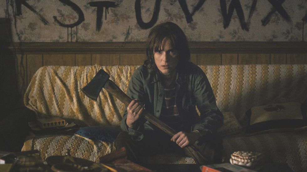 Winona Ryder holding an axe in Stranger Things