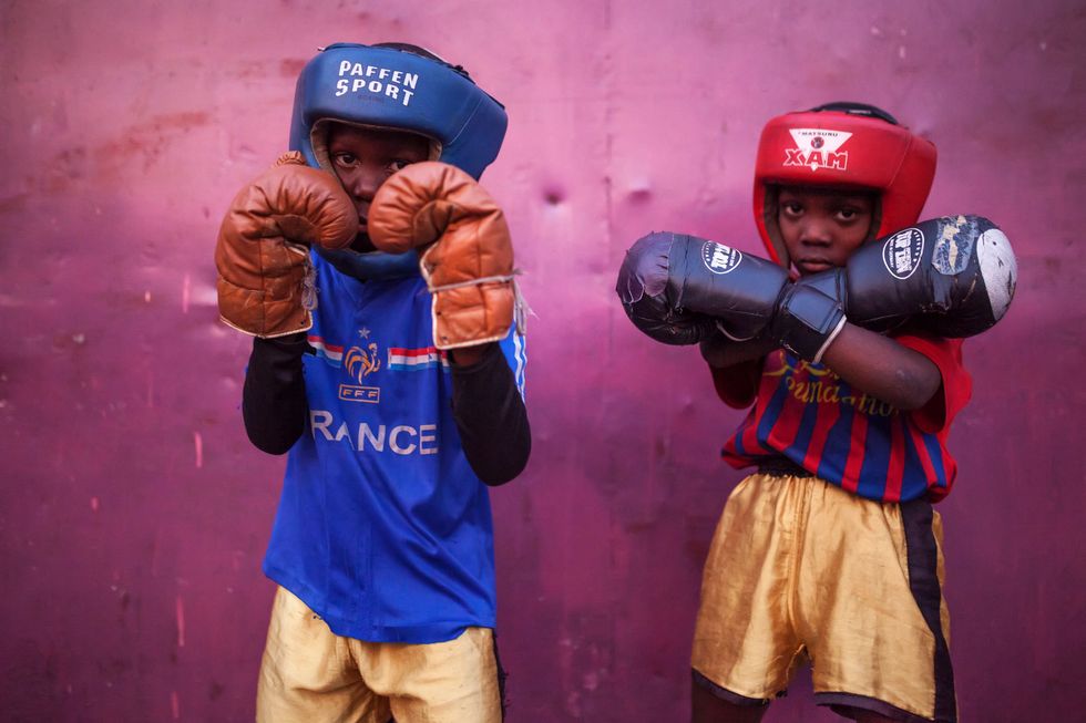 Two kids in their boxing gear.