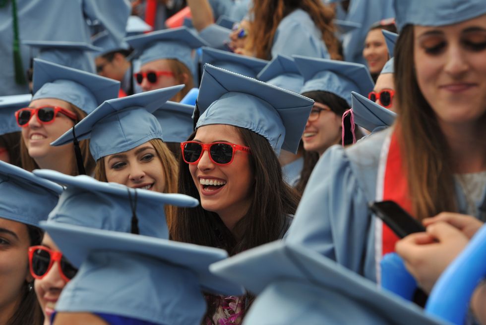 Plenty of reasons to smile for these Liberal Arts students, graduating from Barnard College during the Columbia University 2016 Commencement ceremony in New York May 18, 2016.
