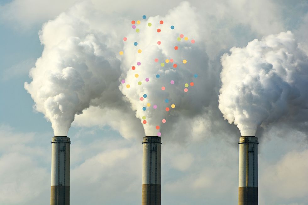 A fossil fuel factory spewing out a flume of confetti, instead of carbon dioxide.