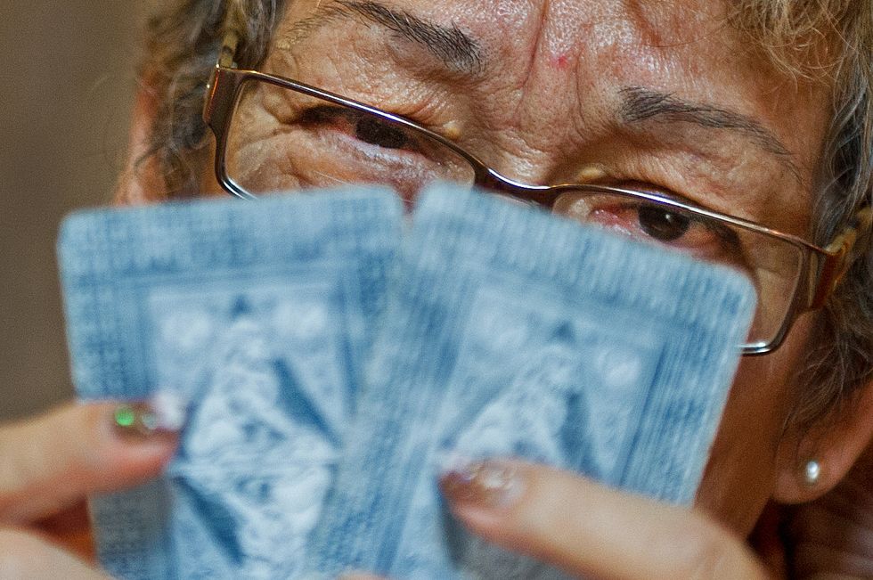 Sylvia Quintero, an astrologist and Tarot card reader, shares her visions on politics and the future. (Photo: PAUL J. RICHARDS/AFP/GettyImages)