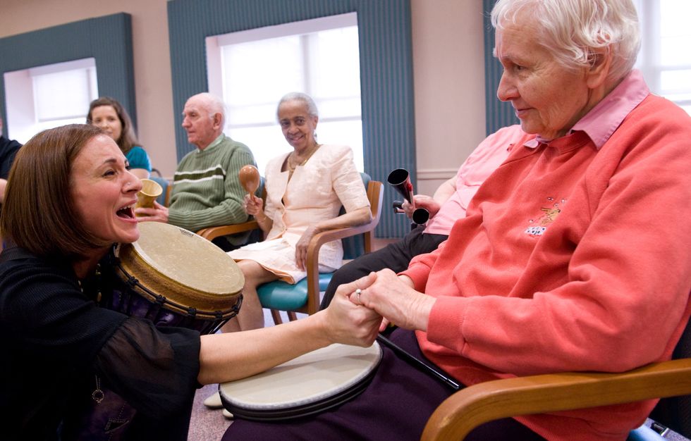 Woman is excited to see Alzheimer's patient.
