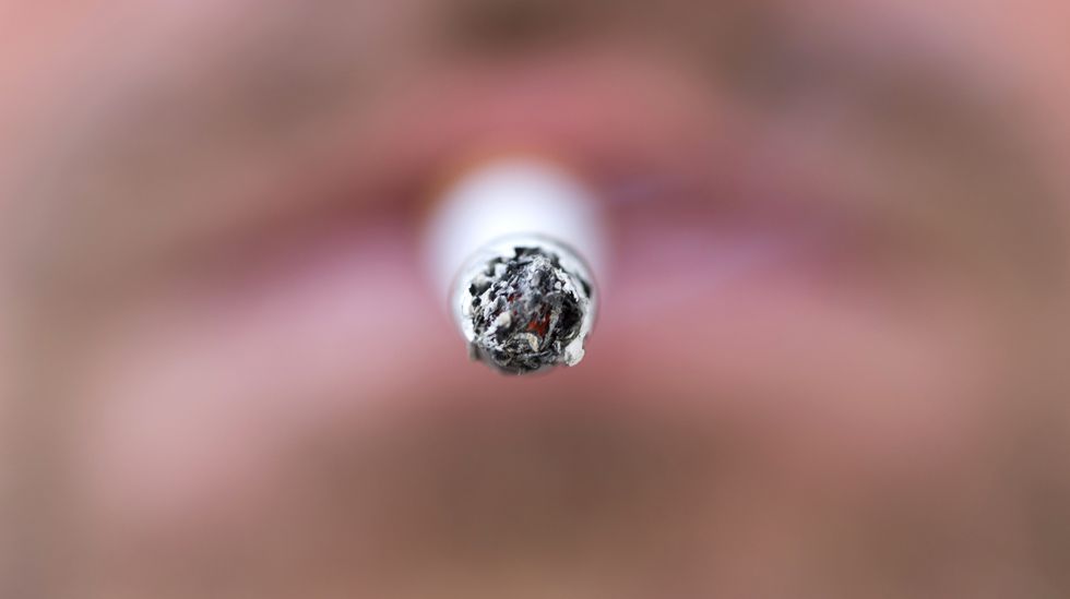 A man smokes a cigarette. (Photo: KENZO TRIBOUILLARD/AFP/Getty Images)