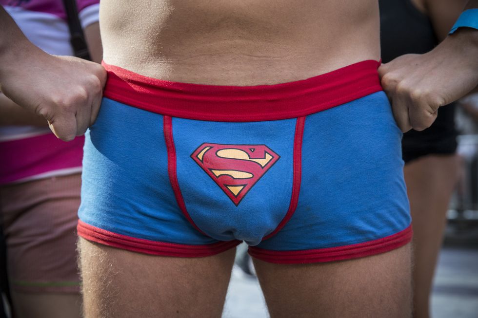 Young man in superman underwear.