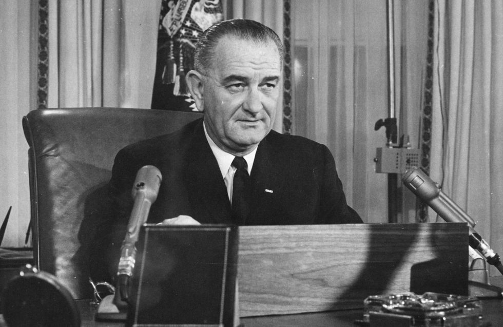 2nd December 1963: American President Lyndon Baines Johnson addresses the nation on his first thanksgiving day television programme, broadcast from the executive offices of the White House. (Photo by Keystone/Getty Images)