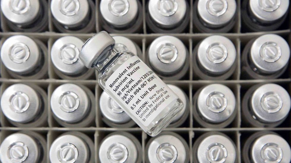 A vial of experimental flu vaccine is seen during a clinical trial to test the effectiveness of the vaccine to combat avian influenza. (Photo by Alex Wong/Getty Images)