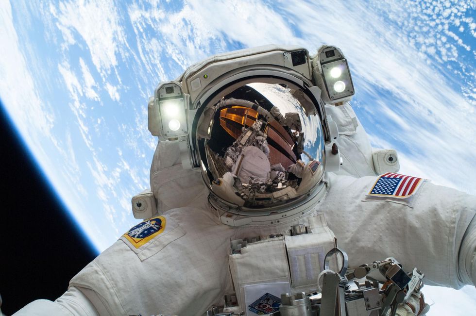 NASA astronaut Mike Hopkins, Expedition 38 flight engineer, participates in the second of two spacewalks, spread over a four-day period, which were designed to allow the crew to change out a faulty water pump on the exterior of the Earth orbiting Internat