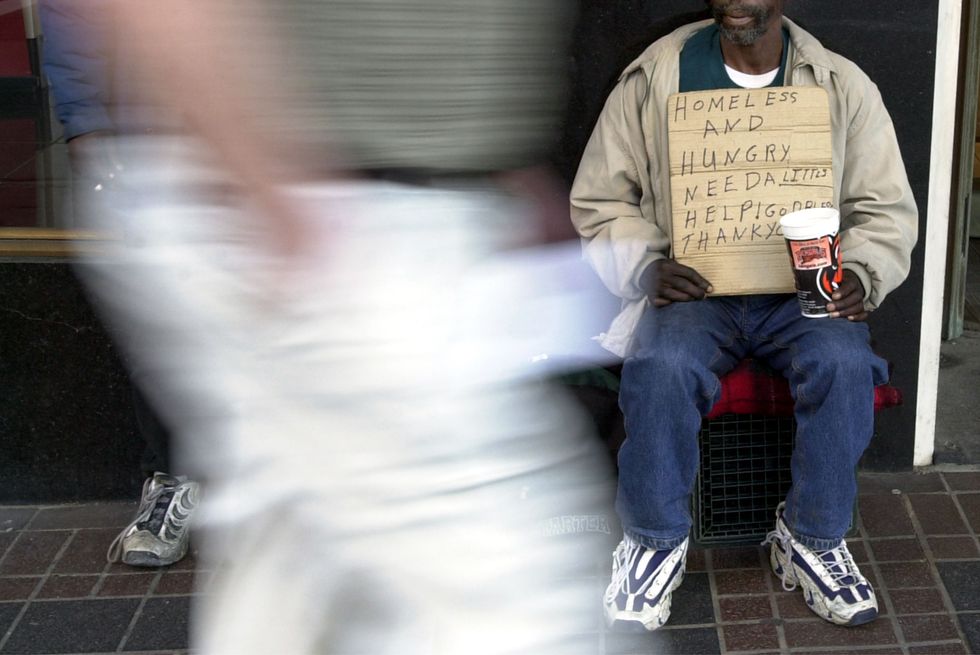 A homeless man panhandling in Cincinnati.