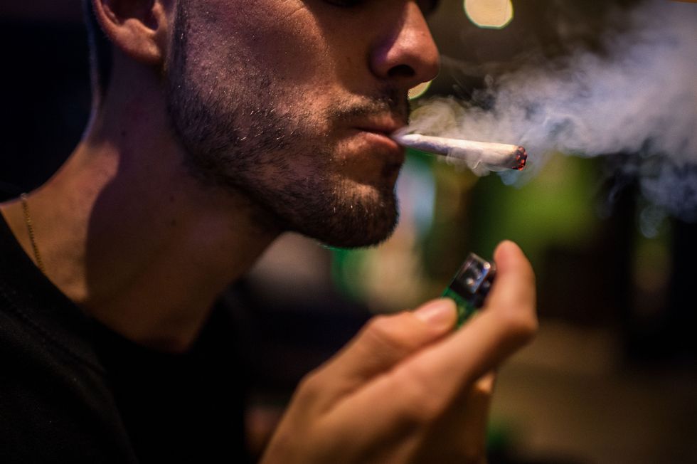 Man smoking a joint.