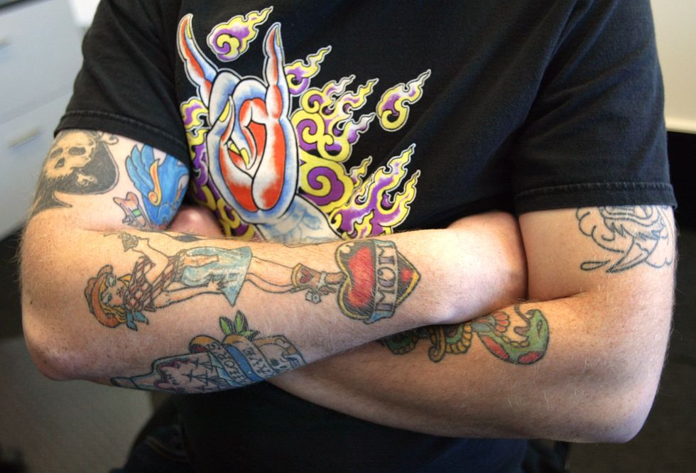 Man with tattoos.