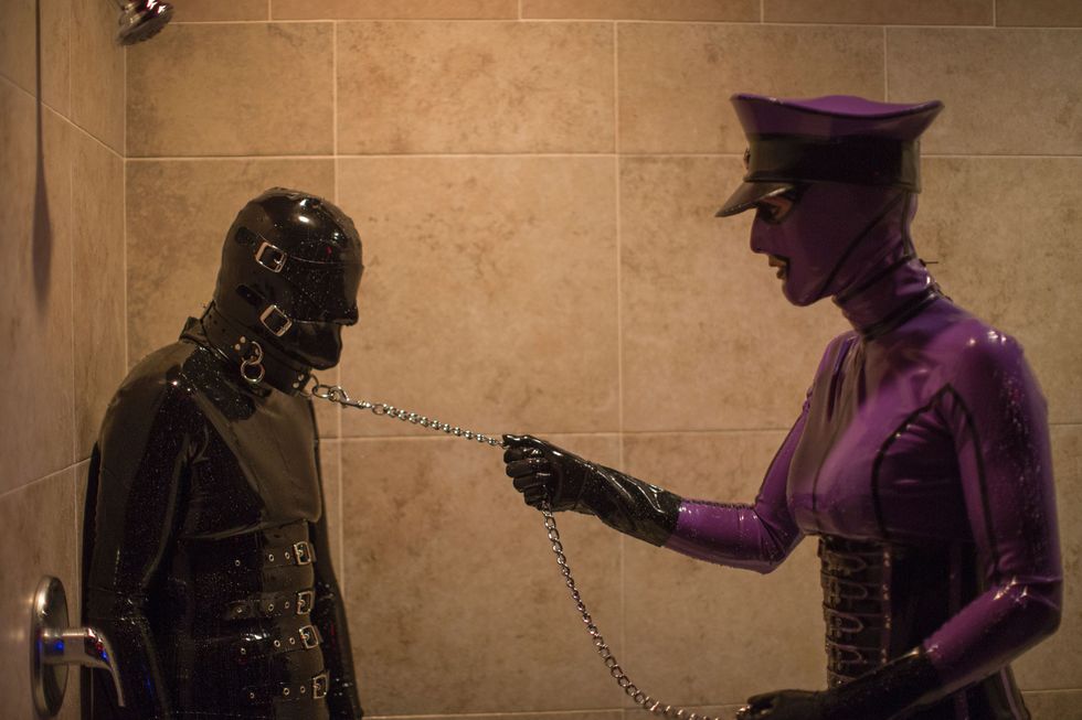 Two fetishists in rubber suits.