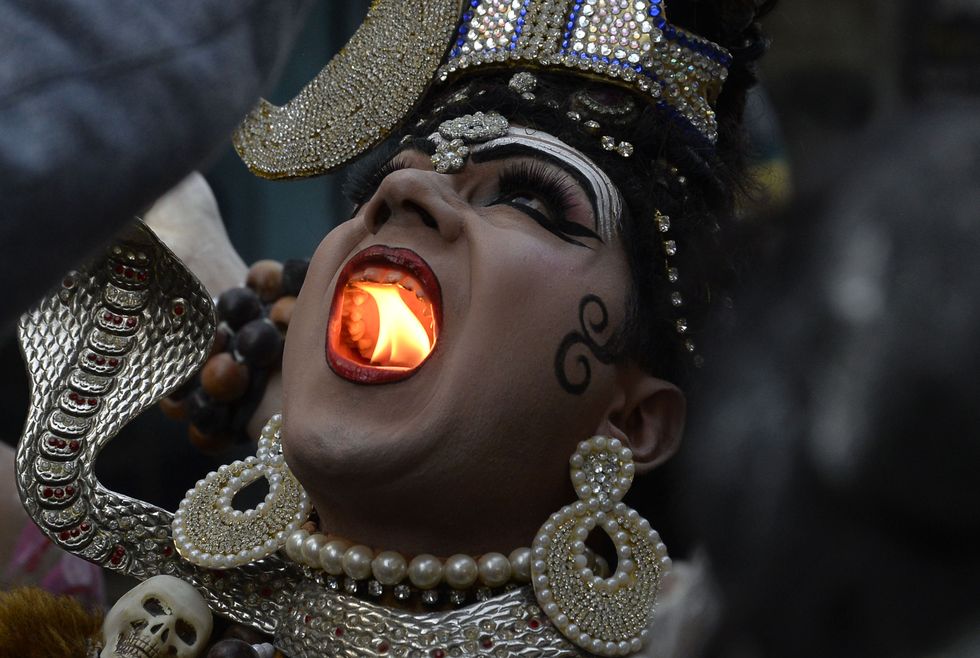Worshiper dressed as a Hindu God.