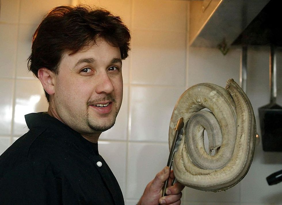 Chef Dan Craven boils a rattle snake to make rattlesnake chilli at the Edible restaurant, which serves unusual and exotic delicacies such as chocolate scorpions and alligator stew. (Photo: Gerry Penny/AFP/Getty Images)