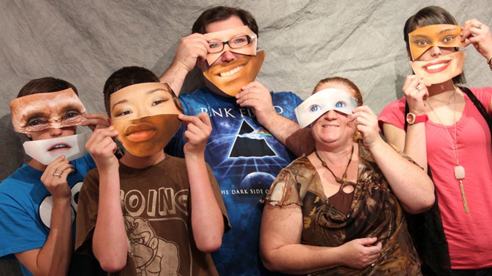 Art students with funny, cut out facial features.