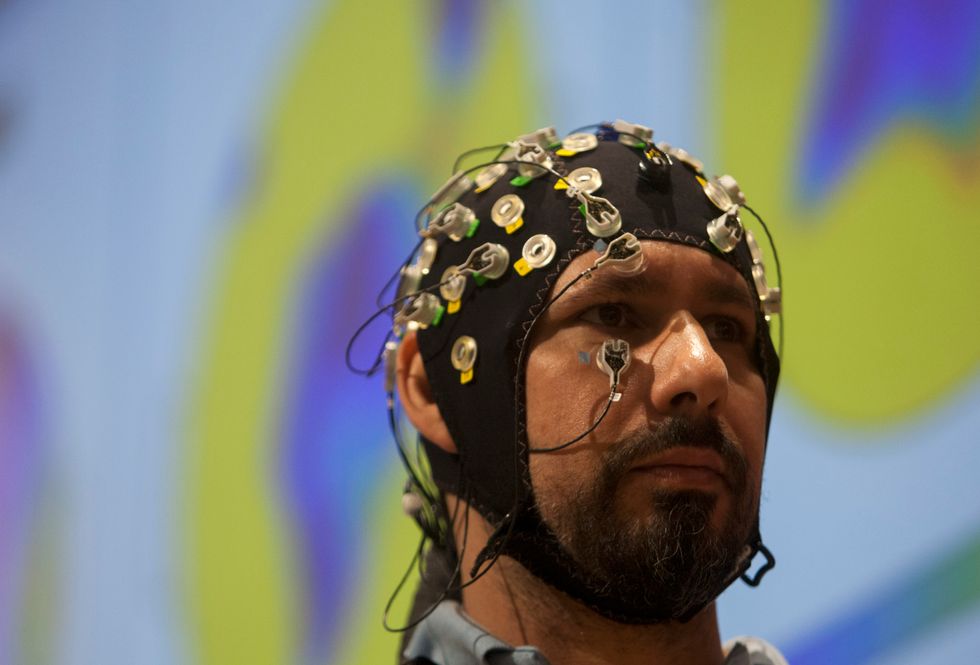 Man in a tDCS cap.