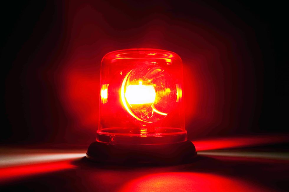 A red emergency light. (Caspar Benson/Getty)