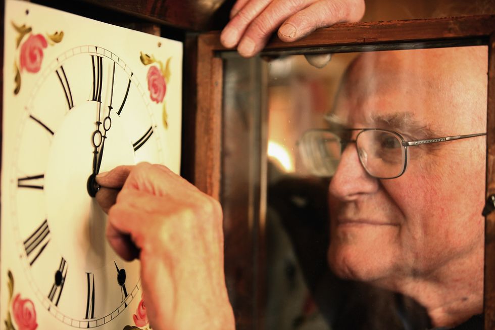 A British man turns the clock ahead.