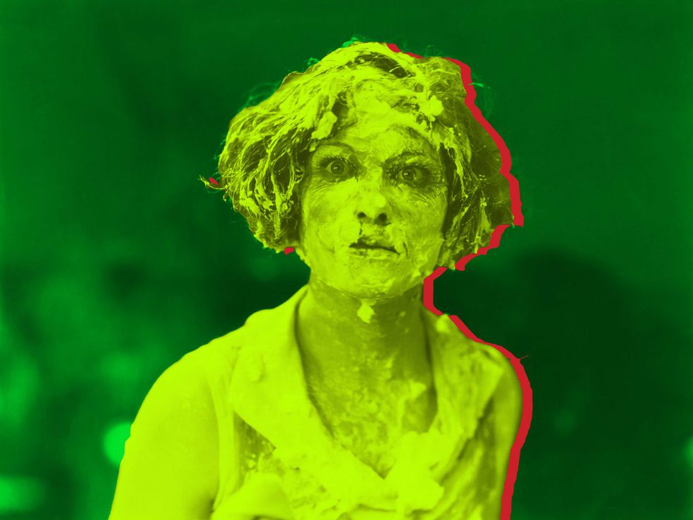 A woman with pie on her face. (Shutterstock/Big Think)