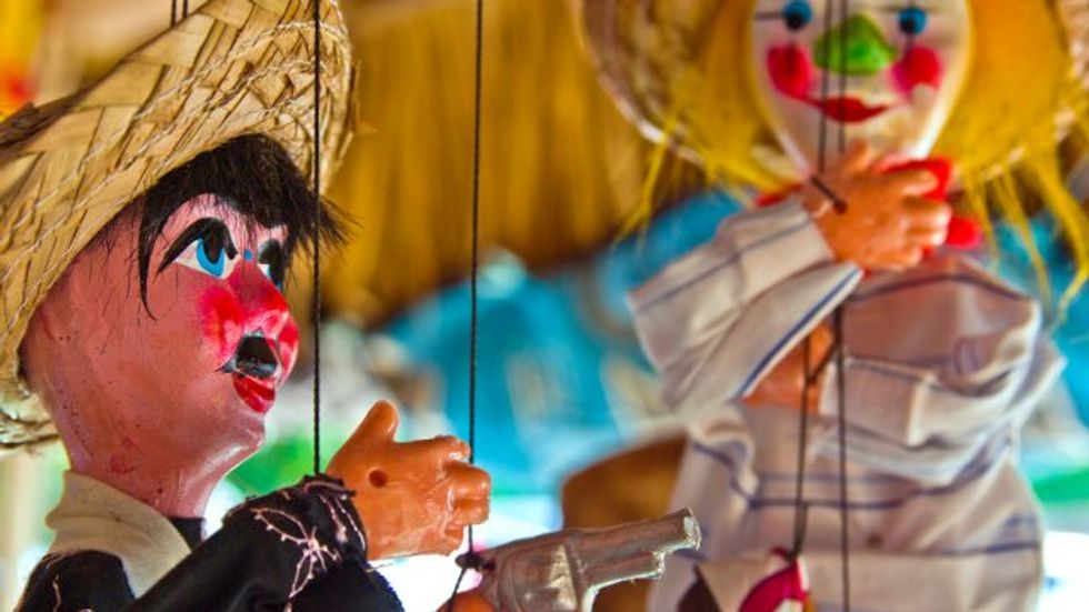 The political economy of puppetry