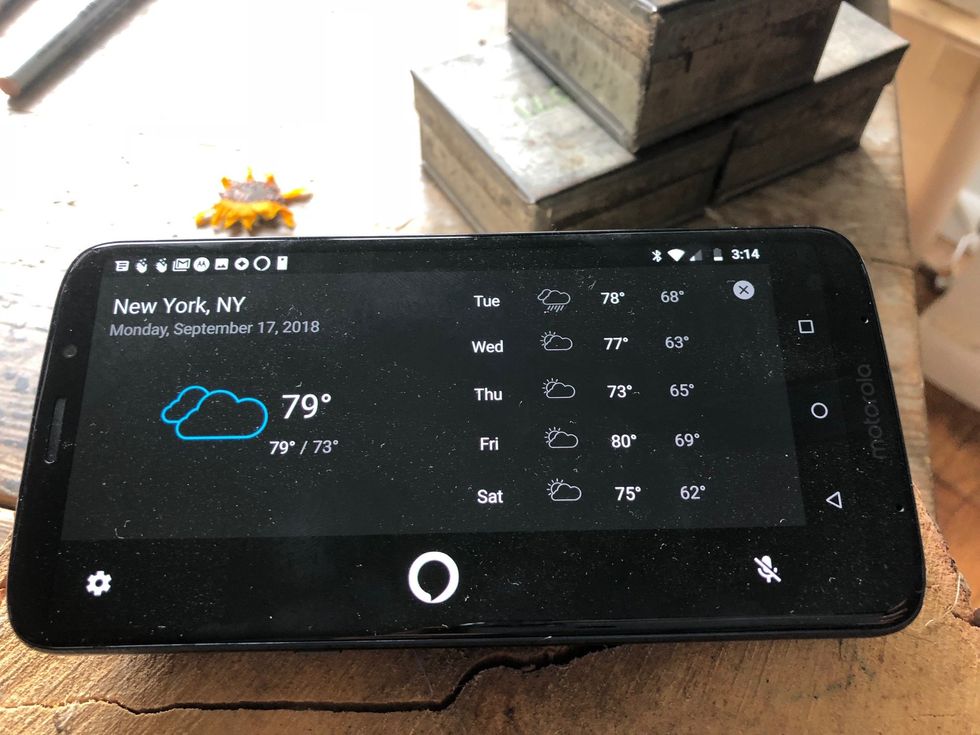 Picture of Moto smartphone with smart speaker attachment