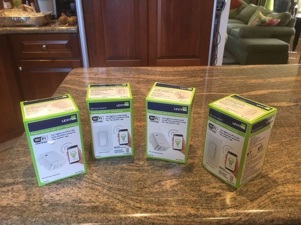Product shot of Leviton Smart Plugs and Switches on a countertop