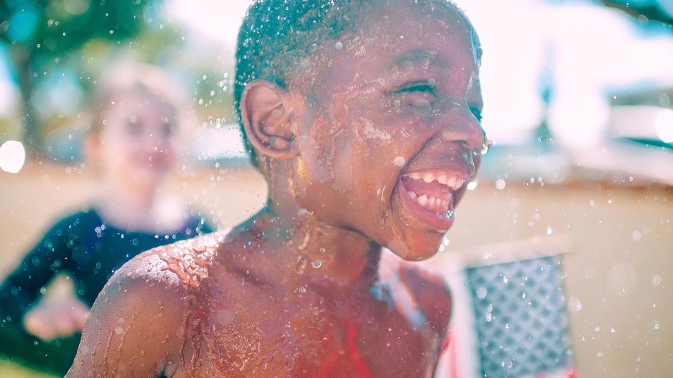 A Child plays in water