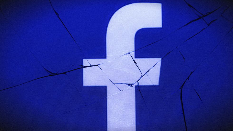 broken Facebook logo smashed screen (Photo: JOEL SAGET/AFP/Getty Images)