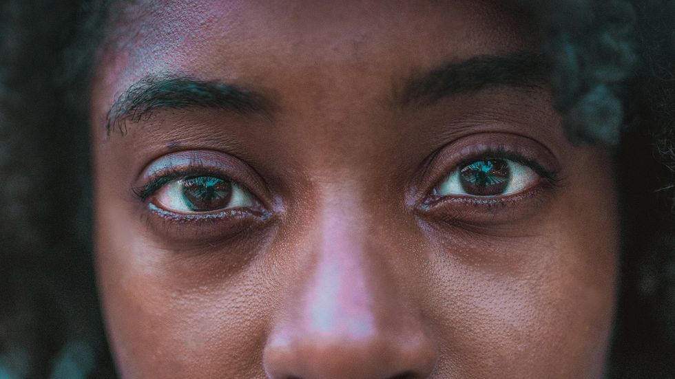 A woman's intense gaze stare with eye contact close up (Photo by Jezael Melgoza on Unsplash)
