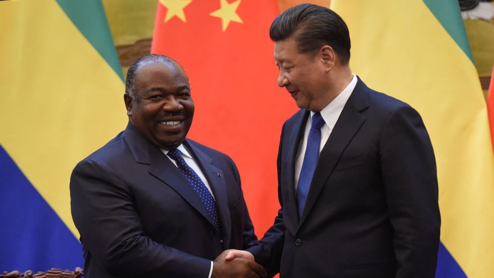 Chinese President Xi Jinping (R) shakes hand of Gabon's President Ali Bongo Ondimba after Gabonese and Chinese delegates signed economic contracts at the Great Hall of the People on December 7, 2016 in Beijing, China. (Photo: Fred Dufour - Pool /Getty Ima