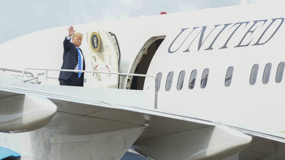 Trump boarding an airplane