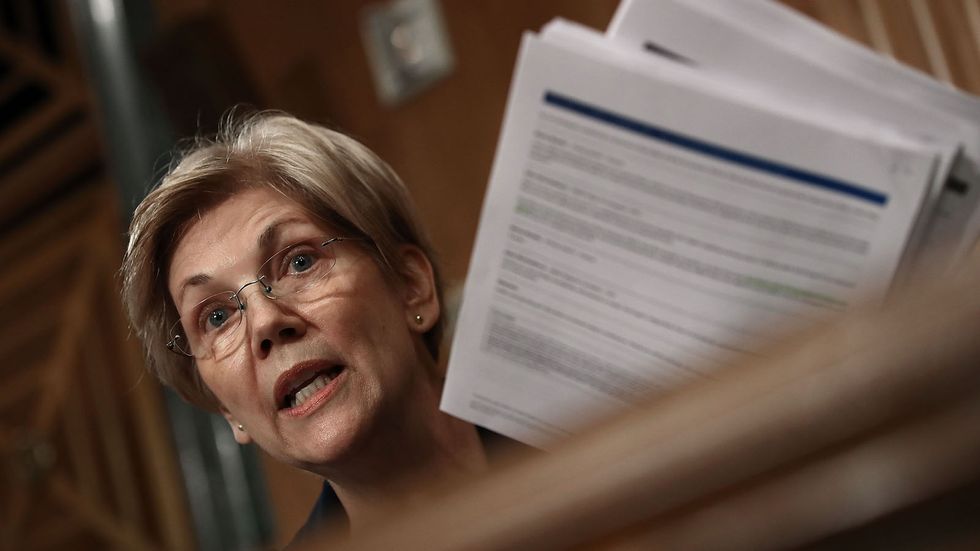 Sen. Elizabeth Warren (D-MA) questions John Stumpf, chairman and CEO of the Wells Fargo & Company, during a hearing of the Senate Banking, Housing and Urban Affairs Committee September 20, 2016 in Washington, DC. (Photo by Win McNamee/Getty Images)