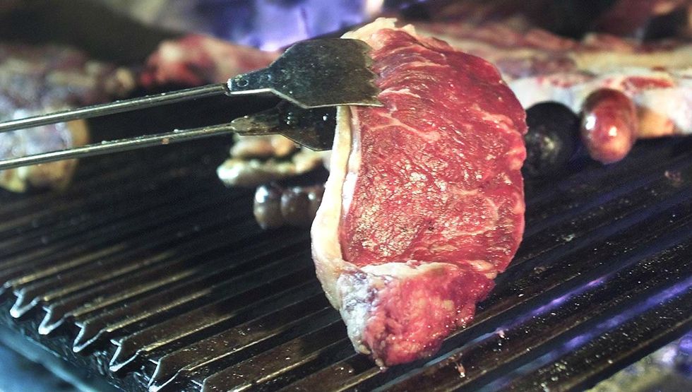 A steak on a grill (MIGUEL MENDEZ/AFP/Getty Images)