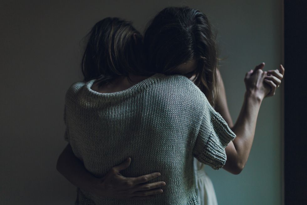 2 women hugging each other