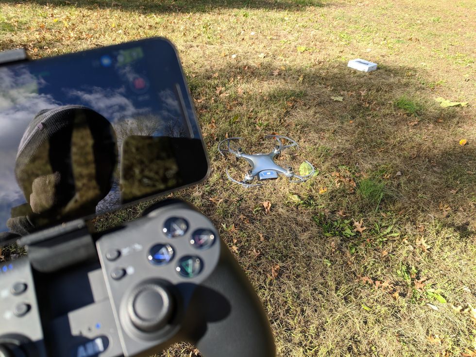 Picture of AEE Mach 1 Drone flying and controller.