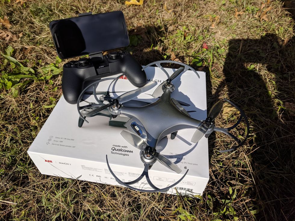 Picture of AEE Mach 1 Drone unboxed on the ground.